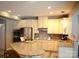 Spacious kitchen featuring granite countertops, modern appliances, and ample cabinet space for cooking and storage at 7170 Kenyon Dr, Denver, NC 28037