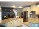 Spacious kitchen features a large island with granite counters and stainless appliances for efficient cooking at 7170 Kenyon Dr, Denver, NC 28037