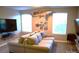 Comfortable living room with large sectional, TV, and creative wall decorations at 7170 Kenyon Dr, Denver, NC 28037