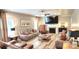 Spacious living room with a fireplace, comfortable seating, and modern decor at 7170 Kenyon Dr, Denver, NC 28037