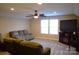 Spacious living room featuring a ceiling fan, large windows, and comfortable seating arrangement at 7170 Kenyon Dr, Denver, NC 28037