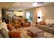 Bright, open-concept living room flows into the kitchen and dining area, ideal for modern living at 7170 Kenyon Dr, Denver, NC 28037