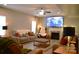 Cozy living room with a fireplace and entertainment center perfect for relaxation and Gathering time at 7170 Kenyon Dr, Denver, NC 28037