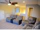Inviting living area with plush sofas, a ceiling fan, and great lighting, perfect for relaxation at 7170 Kenyon Dr, Denver, NC 28037