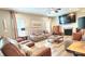 Comfortable living room featuring a fireplace, ample seating, and stylish accents at 7170 Kenyon Dr, Denver, NC 28037