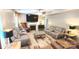 Spacious living room with a fireplace, lots of seating, and ceiling fan at 7170 Kenyon Dr, Denver, NC 28037