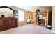 The main bedroom features a sauna, a decorative vanity, an armoire, and carpeted floors at 7170 Kenyon Dr, Denver, NC 28037