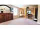 Spacious primary bedroom with ample natural light, decorative furniture, and a private sauna at 7170 Kenyon Dr, Denver, NC 28037