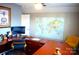 Bright office featuring a large desk, modern computer setup, and stylish decor at 7170 Kenyon Dr, Denver, NC 28037