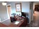 Functional home office with a large desk, computer setup, and neutral decor for productivity at 7170 Kenyon Dr, Denver, NC 28037