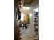 Walk-in pantry providing ample storage with shelving from floor to ceiling and easy access to the dining room at 7170 Kenyon Dr, Denver, NC 28037