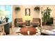 Comfortable sitting room with a decorative rug, and accent chairs at 7170 Kenyon Dr, Denver, NC 28037