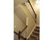 Elegant staircase with dark wood handrail and carpeted steps, offering a classic touch at 7170 Kenyon Dr, Denver, NC 28037