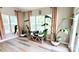 Bright sunroom with big windows, natural light, and wood flooring at 7170 Kenyon Dr, Denver, NC 28037