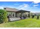 Backyard with patio featuring pergola, seating, privacy fence, and green grass at 7809 Creek Park Dr, Denver, NC 28037