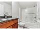 Cozy bathroom with tile floors, shower, granite countertop, and modern fixtures at 7809 Creek Park Dr, Denver, NC 28037