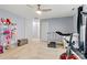 Bedroom with a ceiling fan, natural light and a view of doors in the hallway and walls in a neutral color at 7809 Creek Park Dr, Denver, NC 28037
