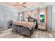 Luxury bedroom with hardwood floors, statement wall mural, and mirror-finished nightstands at 7809 Creek Park Dr, Denver, NC 28037