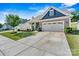 Charming home featuring landscaped yard, a two-car garage and gray and blue exterior at 7809 Creek Park Dr, Denver, NC 28037