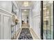 Elegant foyer with a crystal chandelier, decorative console table, and wood-look flooring at 7809 Creek Park Dr, Denver, NC 28037
