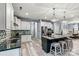 Bright kitchen featuring modern stainless appliances, an island with seating, and pendant lighting at 7809 Creek Park Dr, Denver, NC 28037