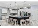 Spacious kitchen with a large island, granite countertops, modern lighting, and stainless steel appliances at 7809 Creek Park Dr, Denver, NC 28037