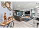 Open-concept living room with a fireplace, stylish decor, and plenty of natural light at 7809 Creek Park Dr, Denver, NC 28037