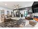 Tastefully decorated living room with a stylish bar and a view of the outdoor area at 7809 Creek Park Dr, Denver, NC 28037