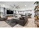 Spacious living room with an electric fireplace, hardwood floors, and an open view to the kitchen at 7809 Creek Park Dr, Denver, NC 28037