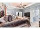 Spacious bedroom featuring a ceiling fan, soft color palette, and plush bedding for a relaxing atmosphere at 7809 Creek Park Dr, Denver, NC 28037