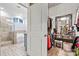 Spacious closet offering ample storage and features, along with a view of the shower and soaking tub at 7809 Creek Park Dr, Denver, NC 28037