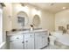 Bathroom with a double vanity, tiled floors, and large soaking tub at 815 Granby Dr, Fort Mill, SC 29708