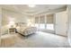 Spacious bedroom with tray ceiling, plush carpet, three windows and modern lamps at 815 Granby Dr, Fort Mill, SC 29708