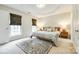 Beautiful bedroom with tray ceilings, carpet flooring, large windows, and stylish decor, creating a cozy and inviting atmosphere at 815 Granby Dr, Fort Mill, SC 29708