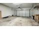Spacious two-car garage with a concrete floor and an automatic door, providing ample space for parking and storage at 815 Granby Dr, Fort Mill, SC 29708