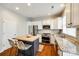 Bright kitchen featuring stainless steel appliances, a granite countertop, and an island with seating at 815 Granby Dr, Fort Mill, SC 29708