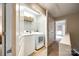 Hallway laundry room with washer and dryer behind closet door at 815 Granby Dr, Fort Mill, SC 29708