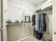 Organized walk-in closet with ample storage space, shelving, and hanging rods for efficient clothing organization at 815 Granby Dr, Fort Mill, SC 29708