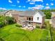 Aerial view of a spacious backyard with patio furniture and lush green lawn at 8460 Fairgreen Ave, Waxhaw, NC 28173