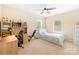 Bedroom with neutral walls, a ceiling fan, and a large desk at 8460 Fairgreen Ave, Waxhaw, NC 28173