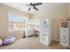 Cozy bedroom featuring a lofted bed with built-in storage and a large window with natural light at 8460 Fairgreen Ave, Waxhaw, NC 28173