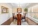 Formal dining room with a chandelier, wainscoting, and a large window at 8460 Fairgreen Ave, Waxhaw, NC 28173