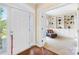 Inviting foyer leads to a living room with custom built-in shelving and a comfortable sitting area at 8460 Fairgreen Ave, Waxhaw, NC 28173