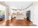 White kitchen with stainless steel appliances, granite countertops, and a breakfast bar at 8460 Fairgreen Ave, Waxhaw, NC 28173