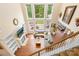 Bright living room with large windows, hardwood floors, and a cozy fireplace at 8460 Fairgreen Ave, Waxhaw, NC 28173