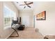 Bright office space with a large window, modern desk, and comfortable seating area at 8460 Fairgreen Ave, Waxhaw, NC 28173