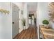 Bright hallway with wood floors, stylish decor, and a view into the open-concept living space at 915 Northeast Dr # 15, Davidson, NC 28036