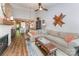 Spacious living room featuring hardwood floors, a fireplace, and an open floor plan to the kitchen at 915 Northeast Dr # 15, Davidson, NC 28036