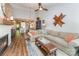 Spacious living room featuring hardwood floors, a fireplace, and an open floor plan to the kitchen at 915 Northeast Dr # 15, Davidson, NC 28036