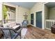 Inviting front porch with wicker furniture, a welcome mat, and a view of the outdoors at 915 Northeast Dr # 15, Davidson, NC 28036